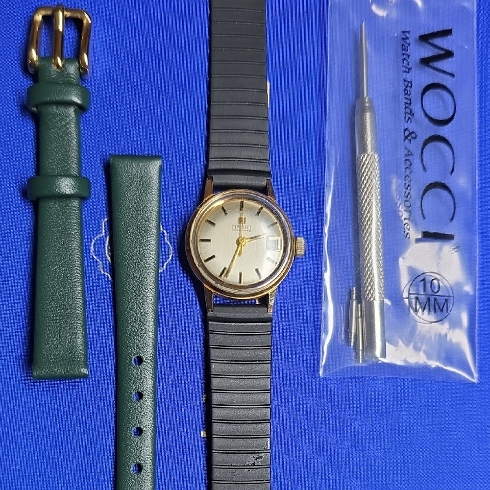 Ladies Gold Tone Watch With Black Rubber Strap And Green Leather Strap With Tool